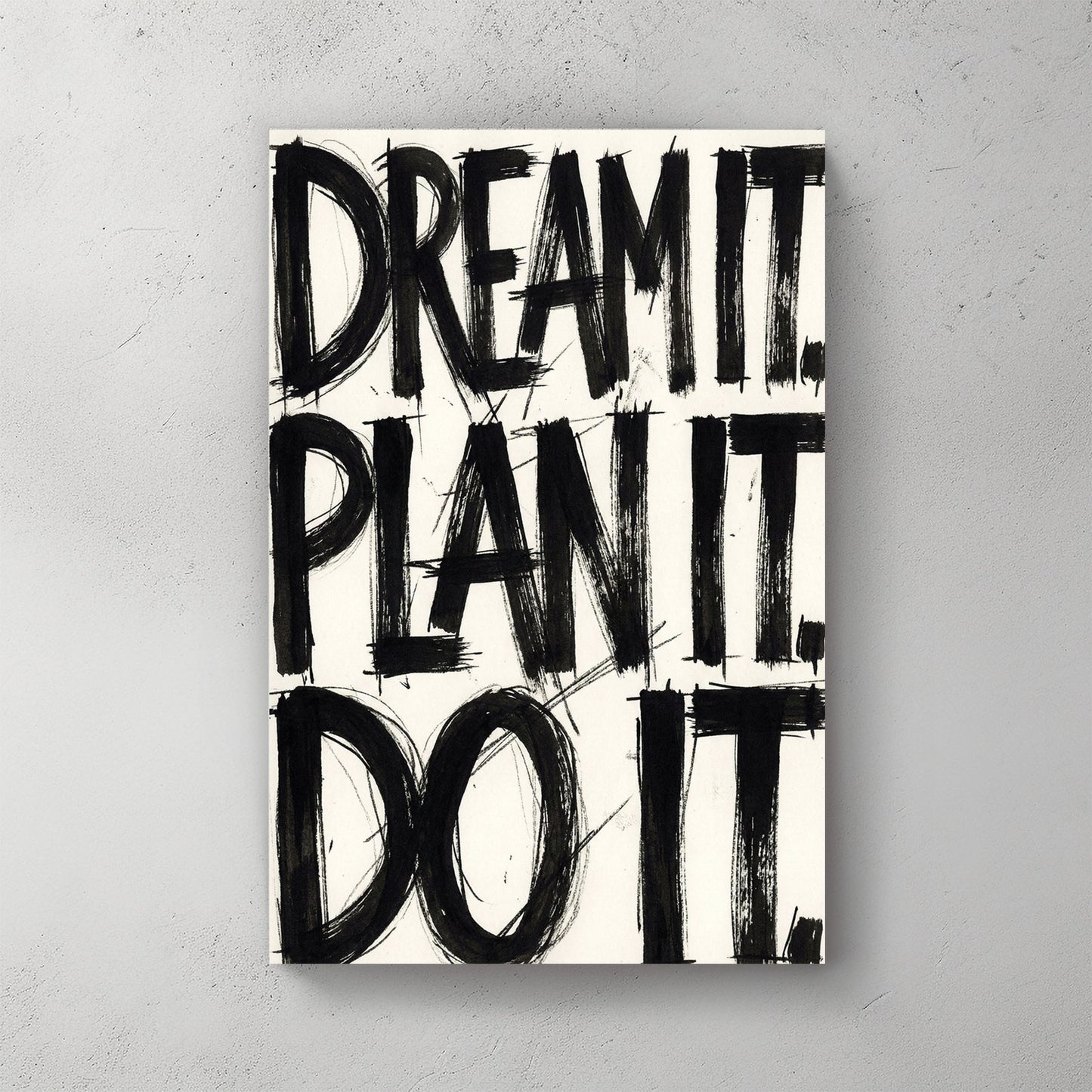 Bold black typography wall art featuring the phrase Dream It Plan It Do It.