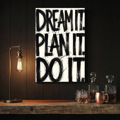 Bold black typography wall art featuring the phrase Dream It Plan It Do It.