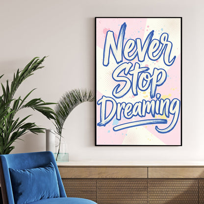 Blue Never Stop Dreaming typography wall art on pastel pink and yellow background.