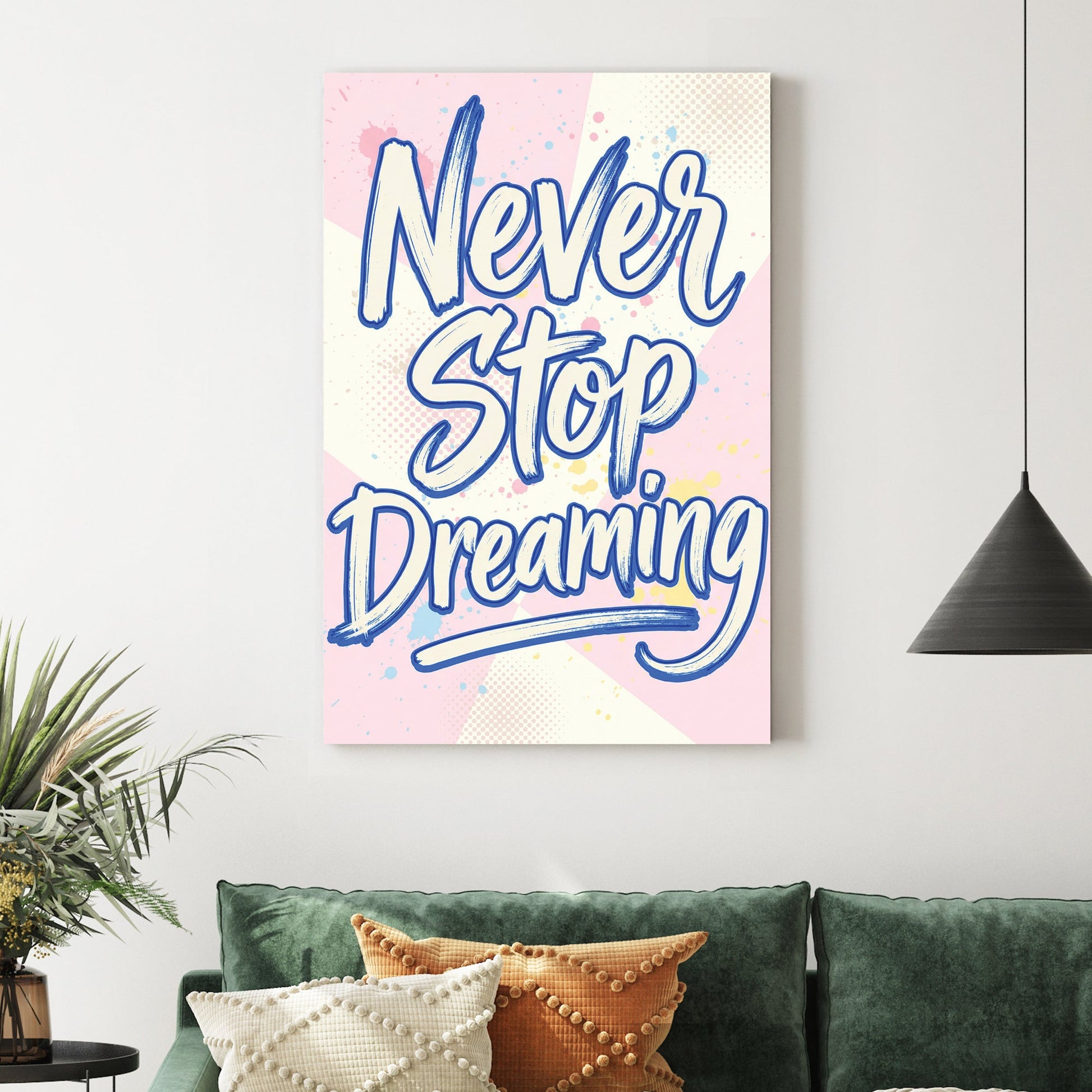 Blue Never Stop Dreaming typography wall art on pastel pink and yellow background.