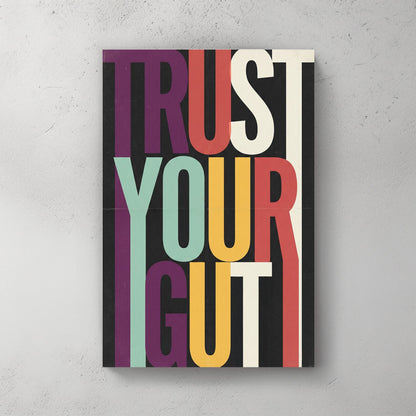 Modern Trust Your Gut typography wall art with colourful elongated letters on black background.