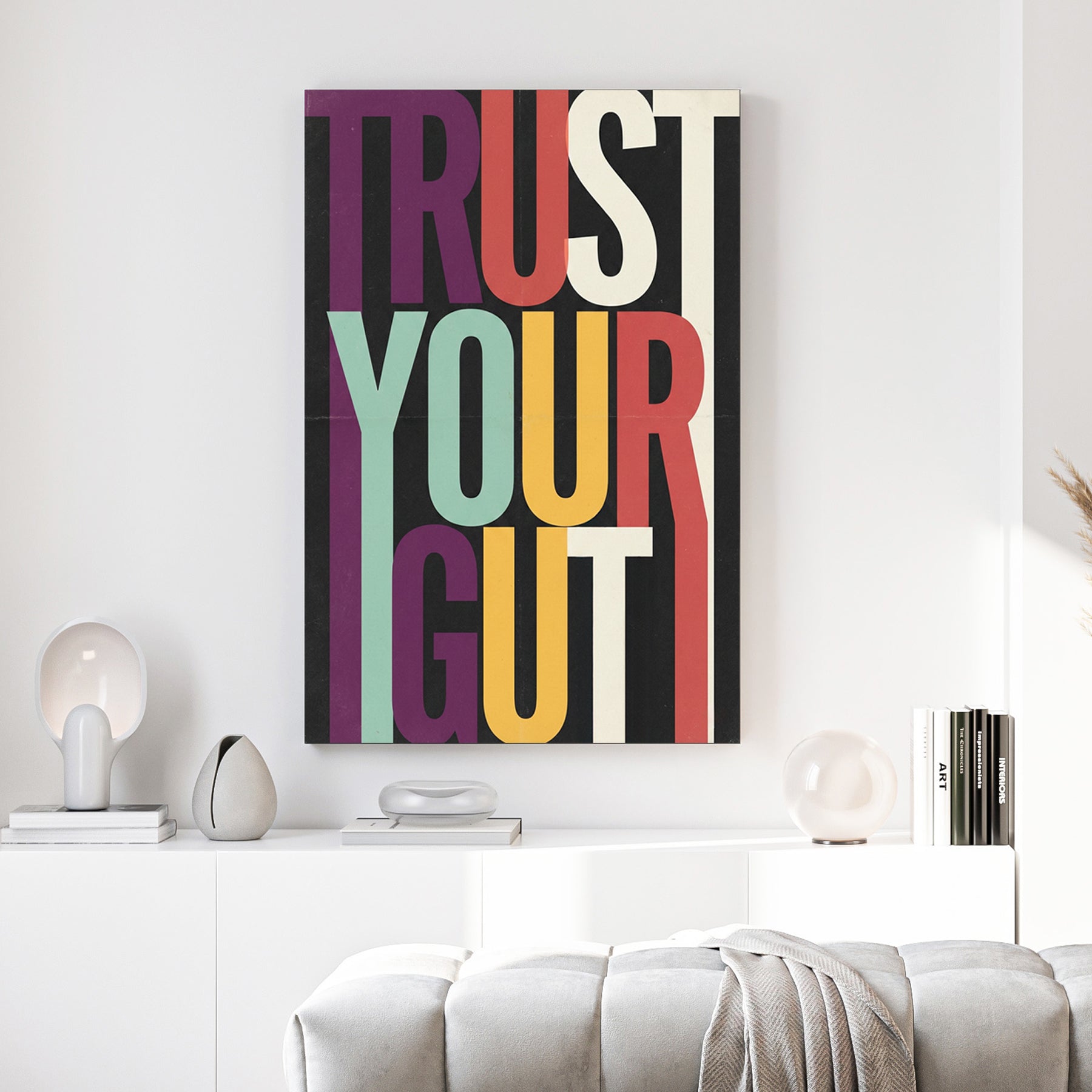 Modern Trust Your Gut typography wall art with colourful elongated letters on black background.
