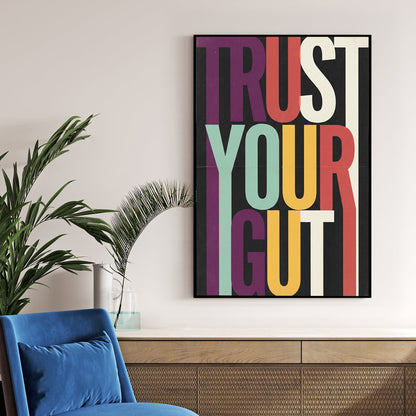 Modern Trust Your Gut typography wall art with colourful elongated letters on black background.