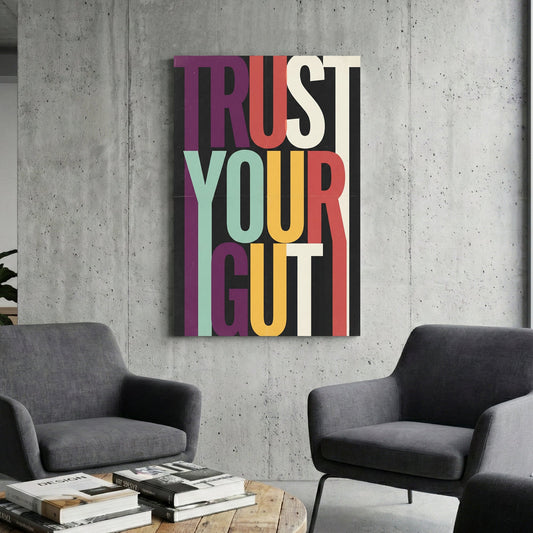 Modern Trust Your Gut typography wall art with colourful elongated letters on black background.