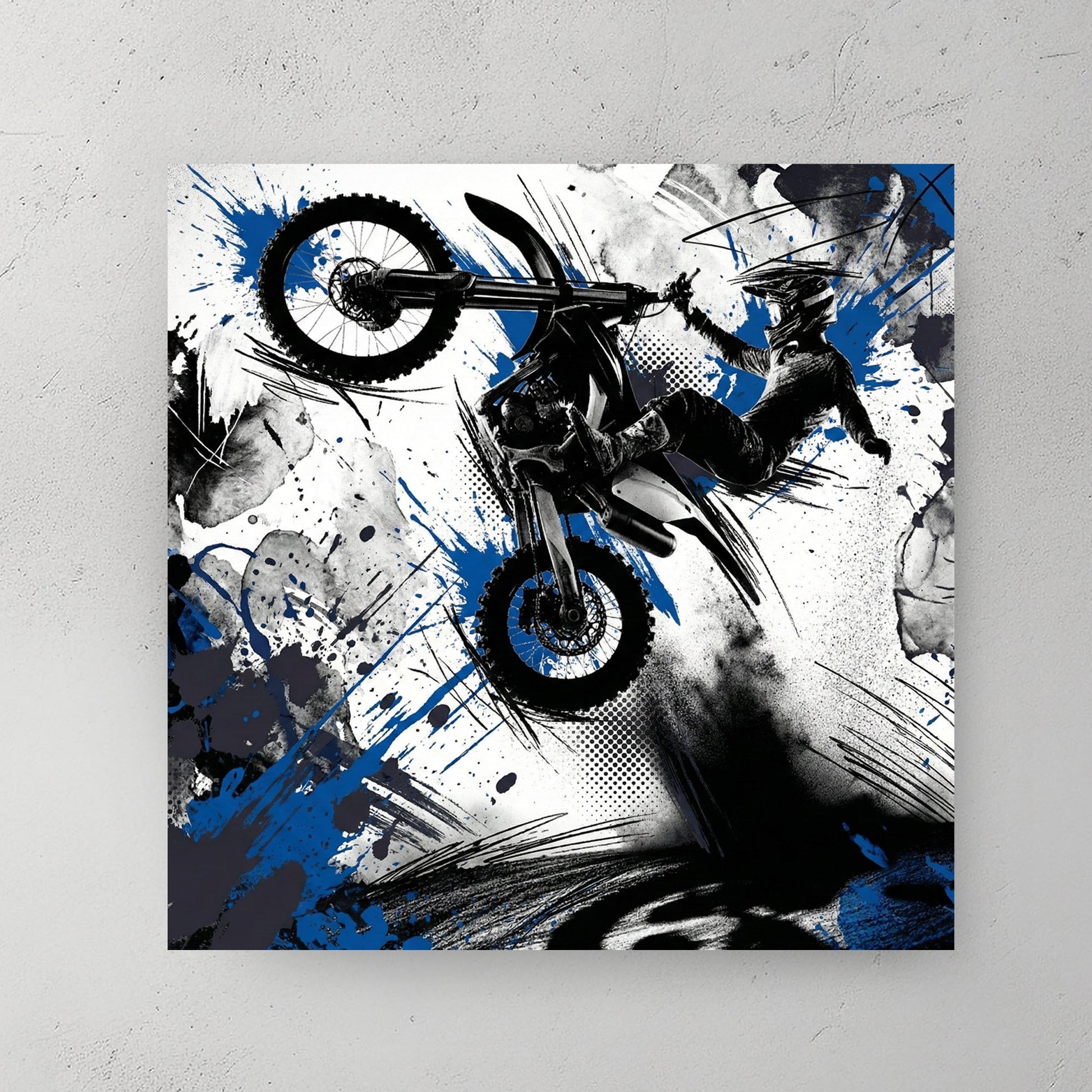 Motocross rider on bike in mid-jump with blue ink splatters and geometric design