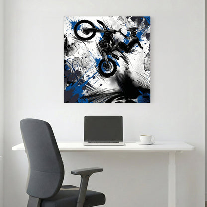 Motocross rider on bike in mid-jump with blue ink splatters and geometric design