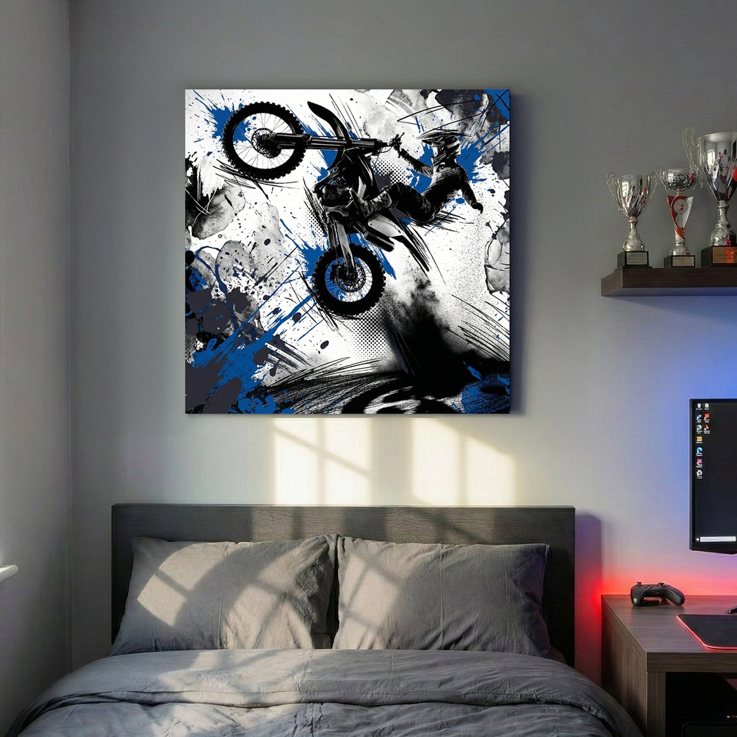 Motocross rider on bike in mid-jump with blue ink splatters and geometric design