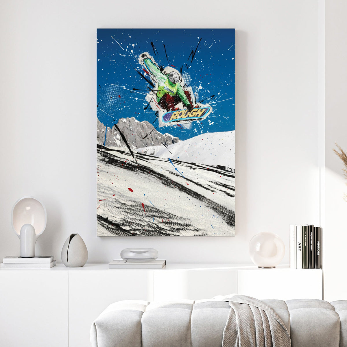 Snowboarder mid-air against blue sky with green and white paint splatters and line work