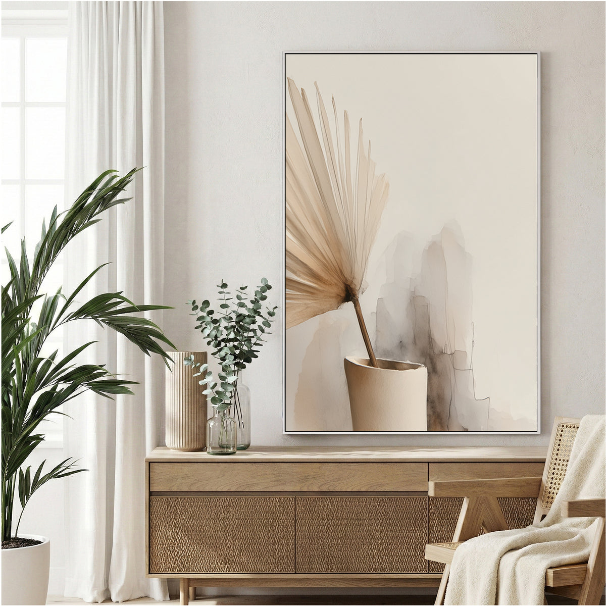 Minimalist vase with floral stems in soft neutral tones