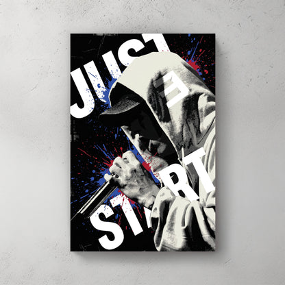 Eminem in dark hoodie holding mic, red and blue splatter paint, JUST START text wrapping around frame — canvas wall art print