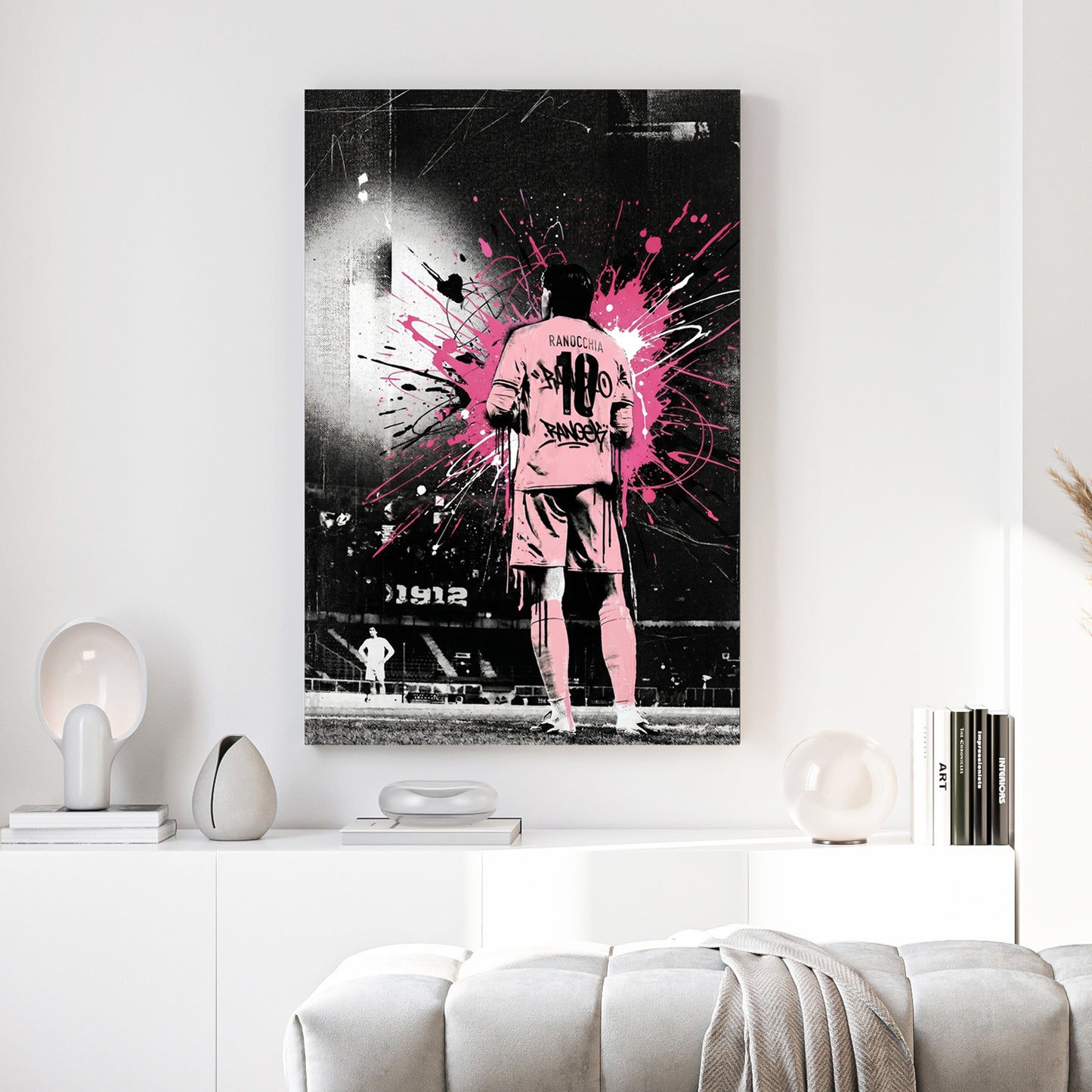 Ranocchia Palermo FC Pink Splatter canvas wall art print above a sofa in a contemporary living room