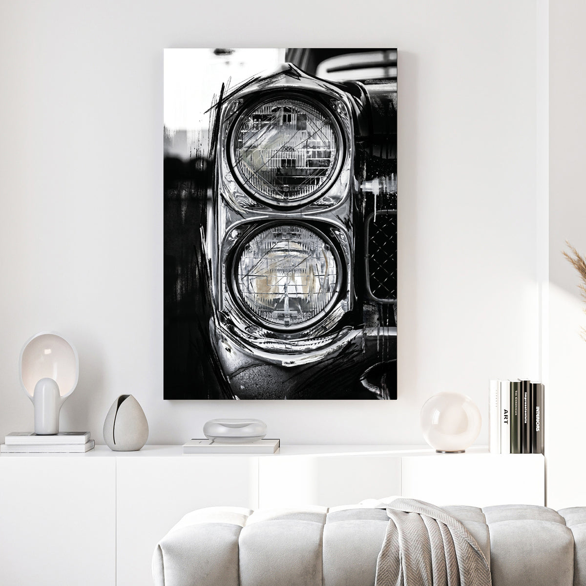 Classic Car Dual Headlights Black and White canvas wall art print above a sofa in a contemporary living room