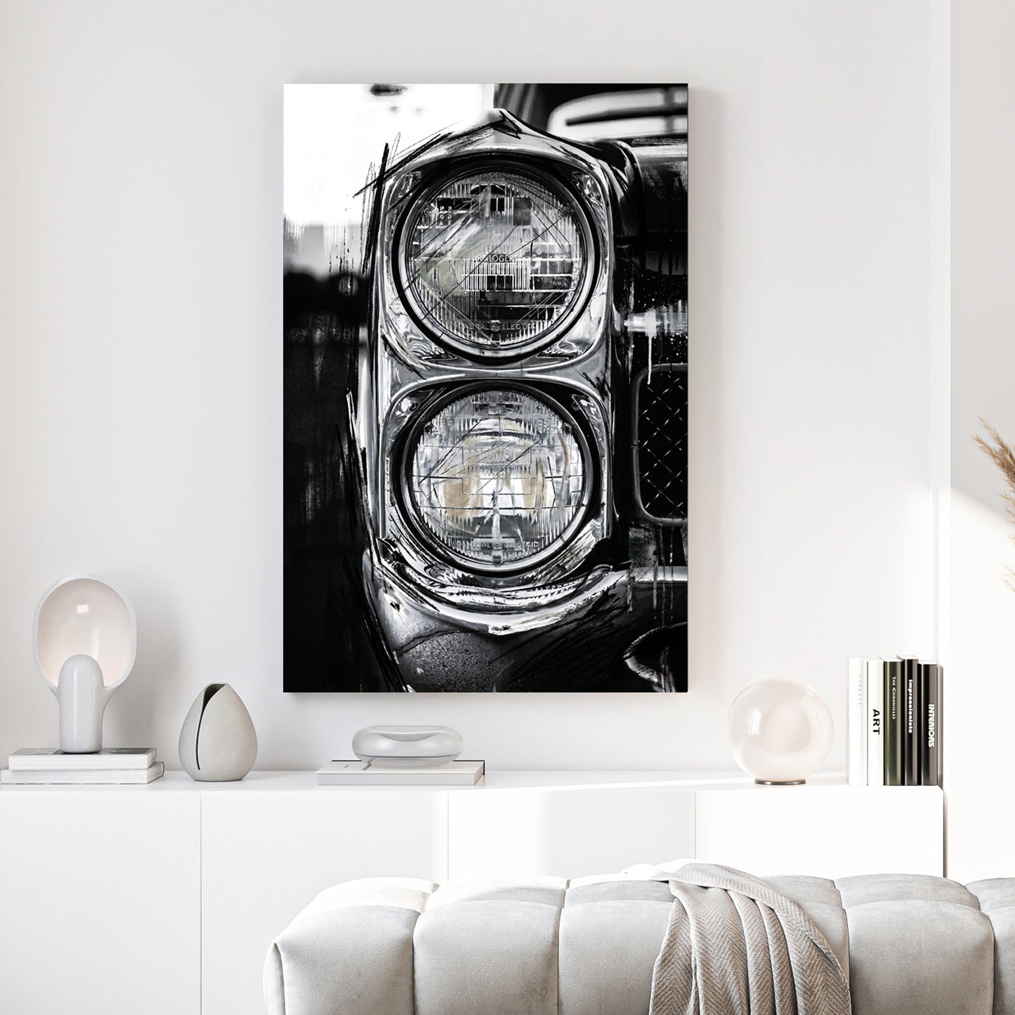 Classic Car Dual Headlights Black and White canvas wall art print above a sofa in a contemporary living room