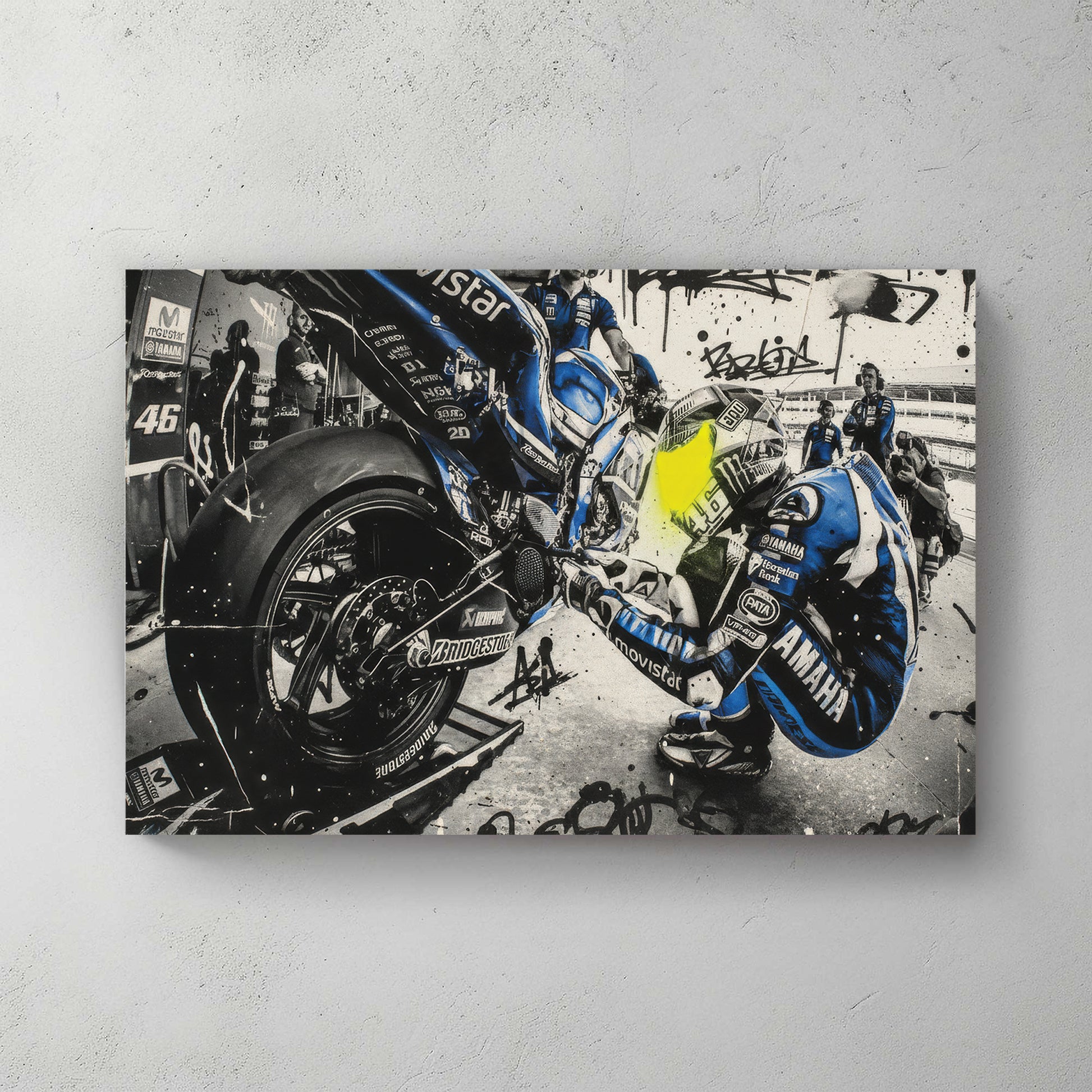 Valentino Rossi MotoGP pit stop scene, blue Movistar Yamaha leathers, mechanics swarming the bike, graffiti tags and splatter overlay — canvas wall art print