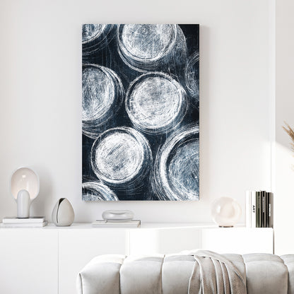 Navy Blue Circles Abstract canvas wall art print above a sofa in a contemporary living room