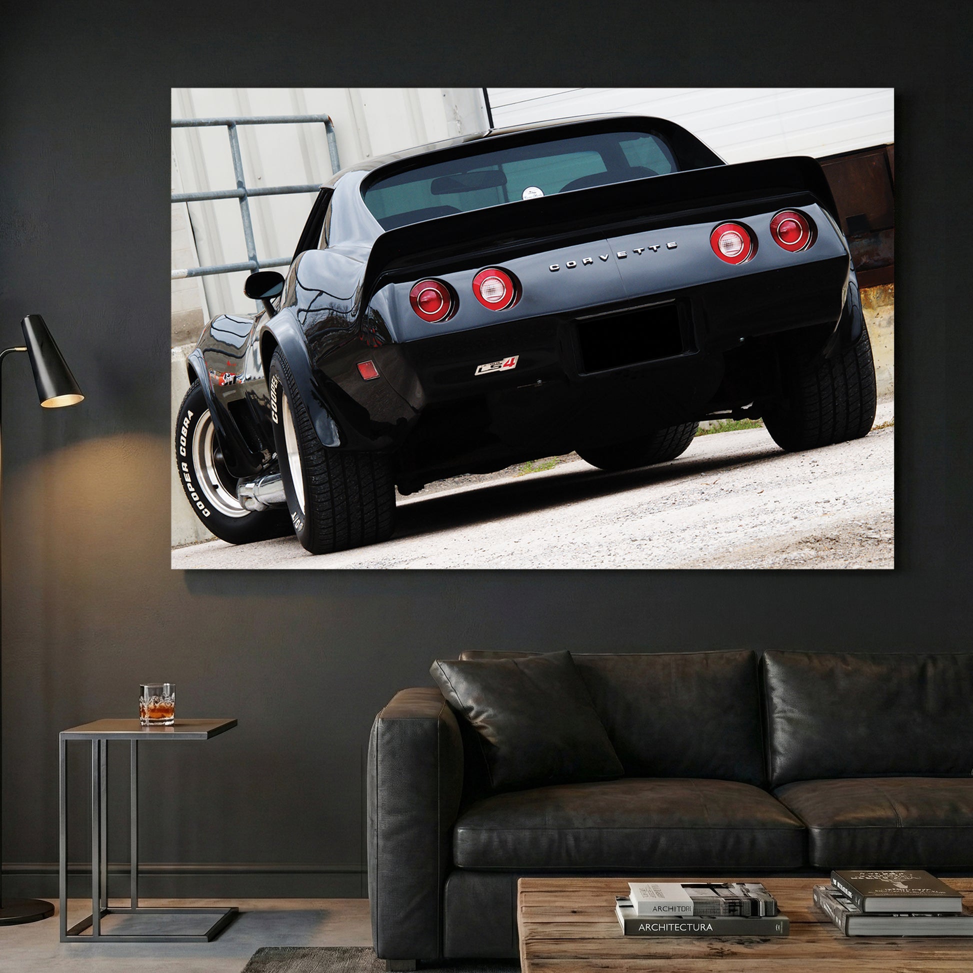 Black Corvette Stingray Rear canvas wall art print displayed in a styled living room