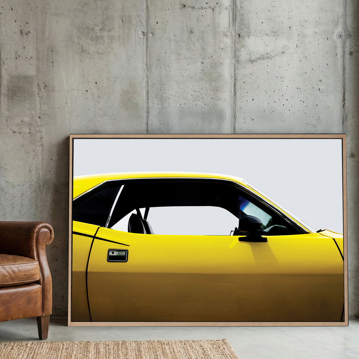 Yellow Plymouth Cuda canvas wall art print displayed in a styled living room