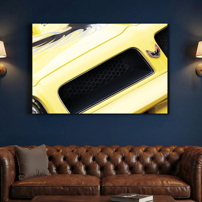 Yellow Trans-Am Firebird Hood canvas wall art print above a sofa in a contemporary living room