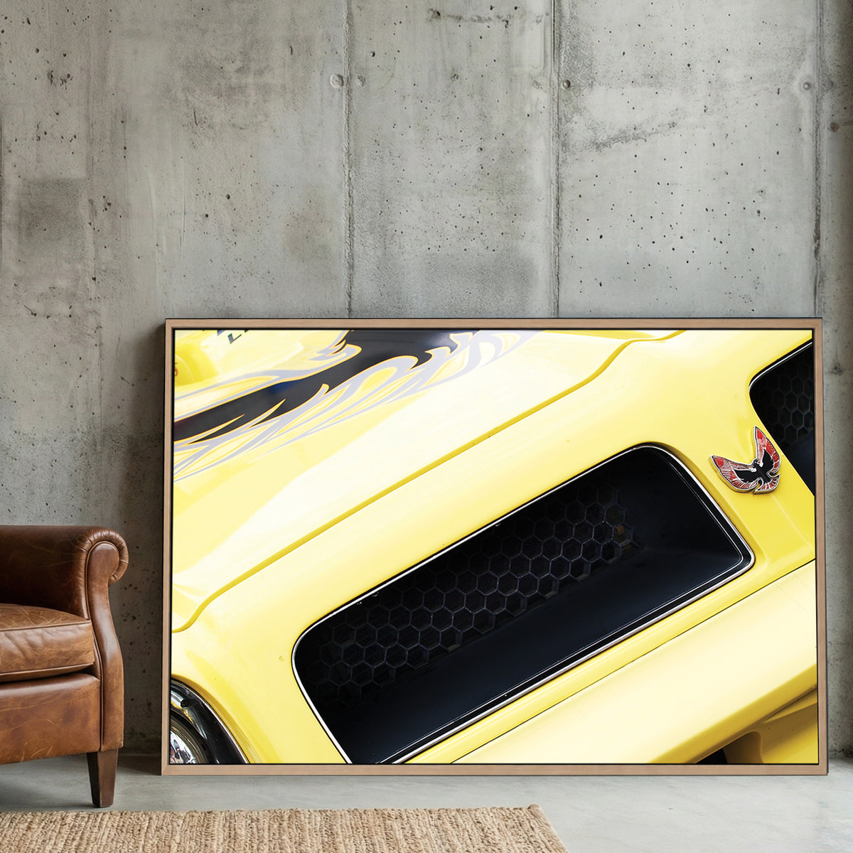 Yellow Trans-Am Firebird Hood canvas wall art print displayed in a styled living room
