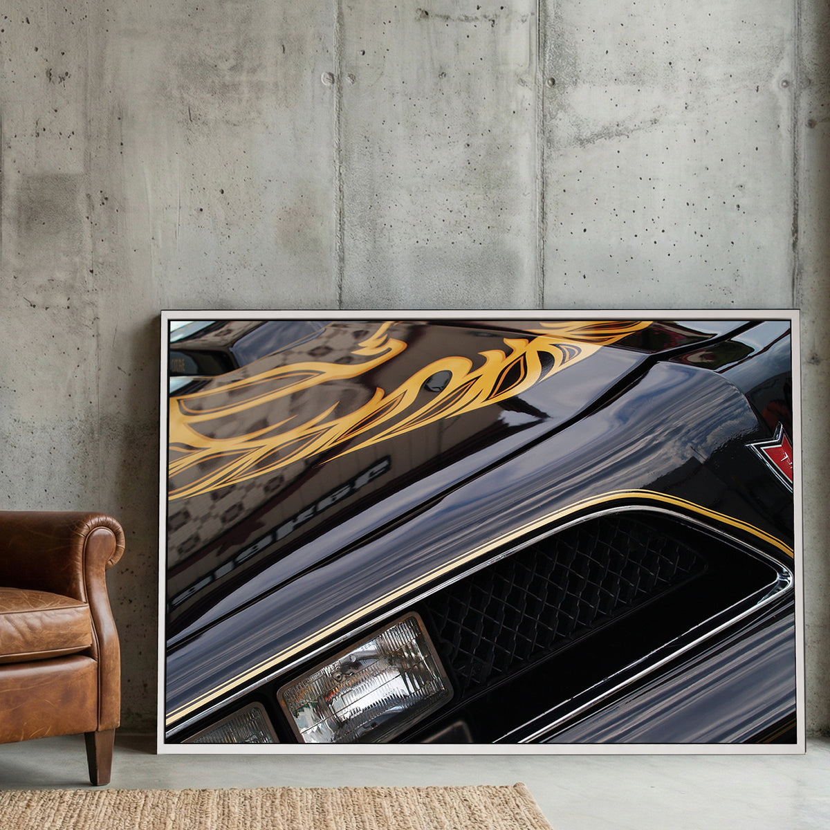 Black and Gold Trans-Am Firebird canvas wall art print displayed in a styled living room