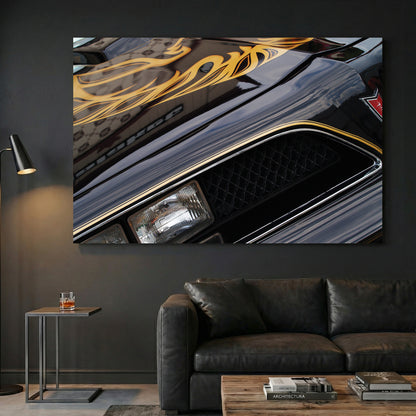 Black and Gold Trans-Am Firebird canvas wall art print displayed in a styled living room