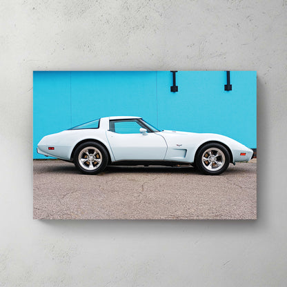 Pale ice-blue and white C3 Corvette side profile against a bright turquoise wall, chrome mag wheels — canvas wall art print
