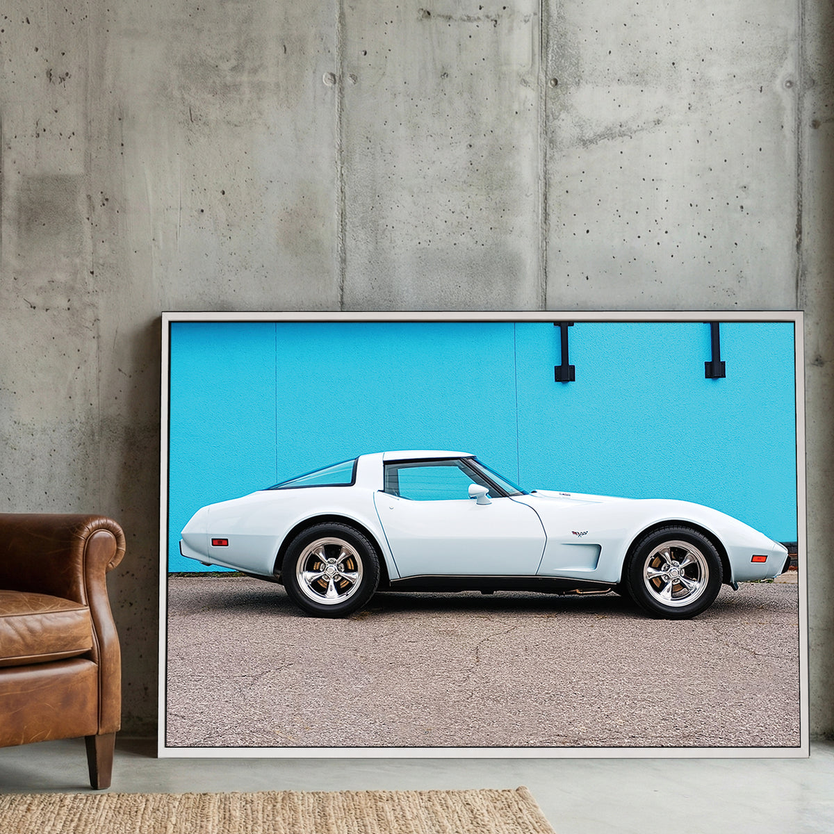 White Corvette Stingray canvas wall art print displayed in a styled living room