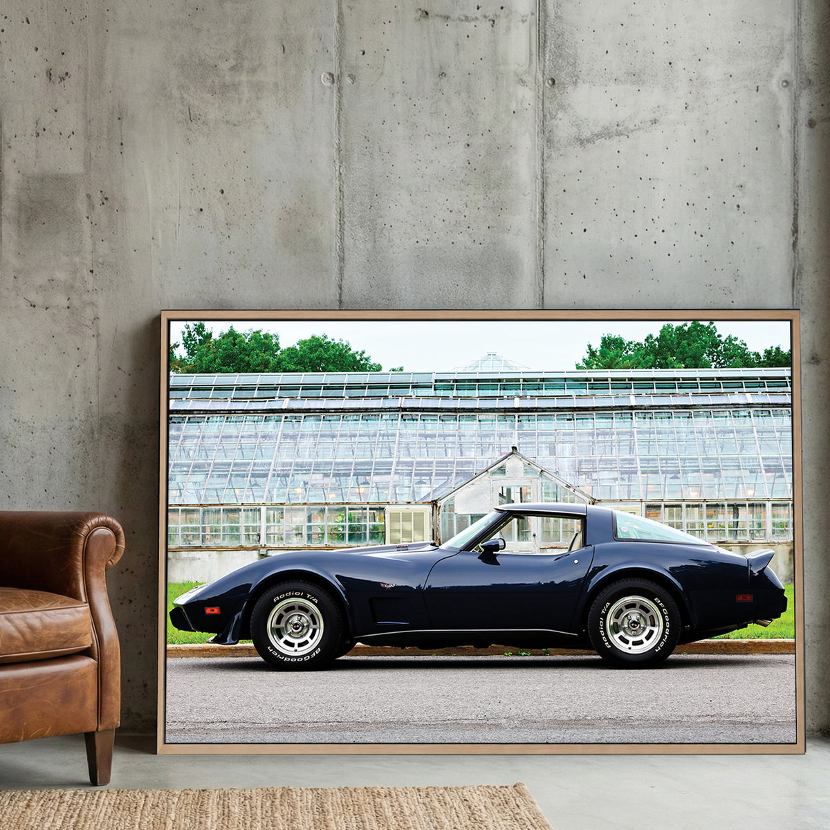 Navy Corvette Stingray canvas wall art print displayed in a styled living room