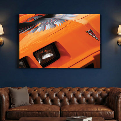 Orange Trans-Am Firebird canvas wall art print above a sofa in a contemporary living room