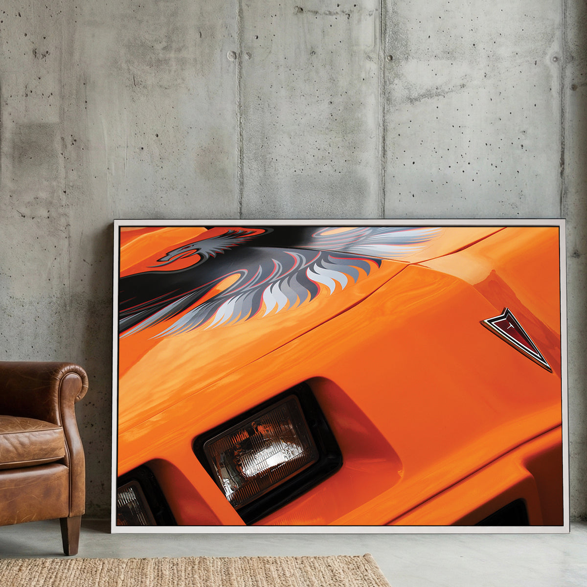 Orange Trans-Am Firebird canvas wall art print displayed in a styled living room