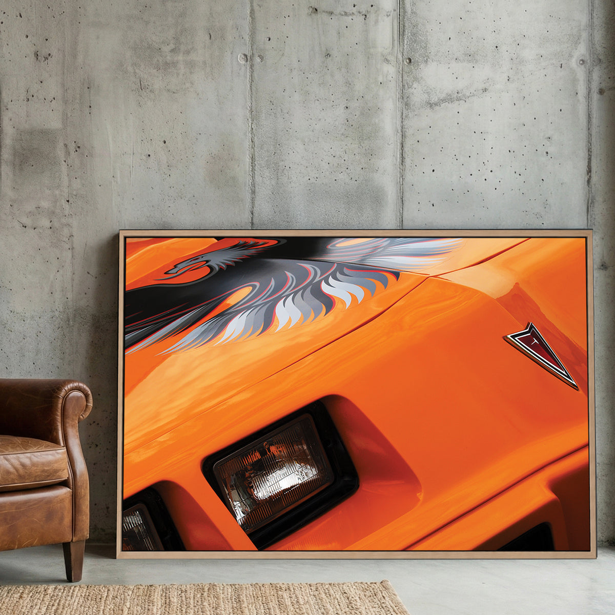 Orange Trans-Am Firebird canvas wall art print displayed in a styled living room