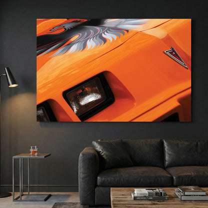Orange Trans-Am Firebird canvas wall art print displayed in a styled living room