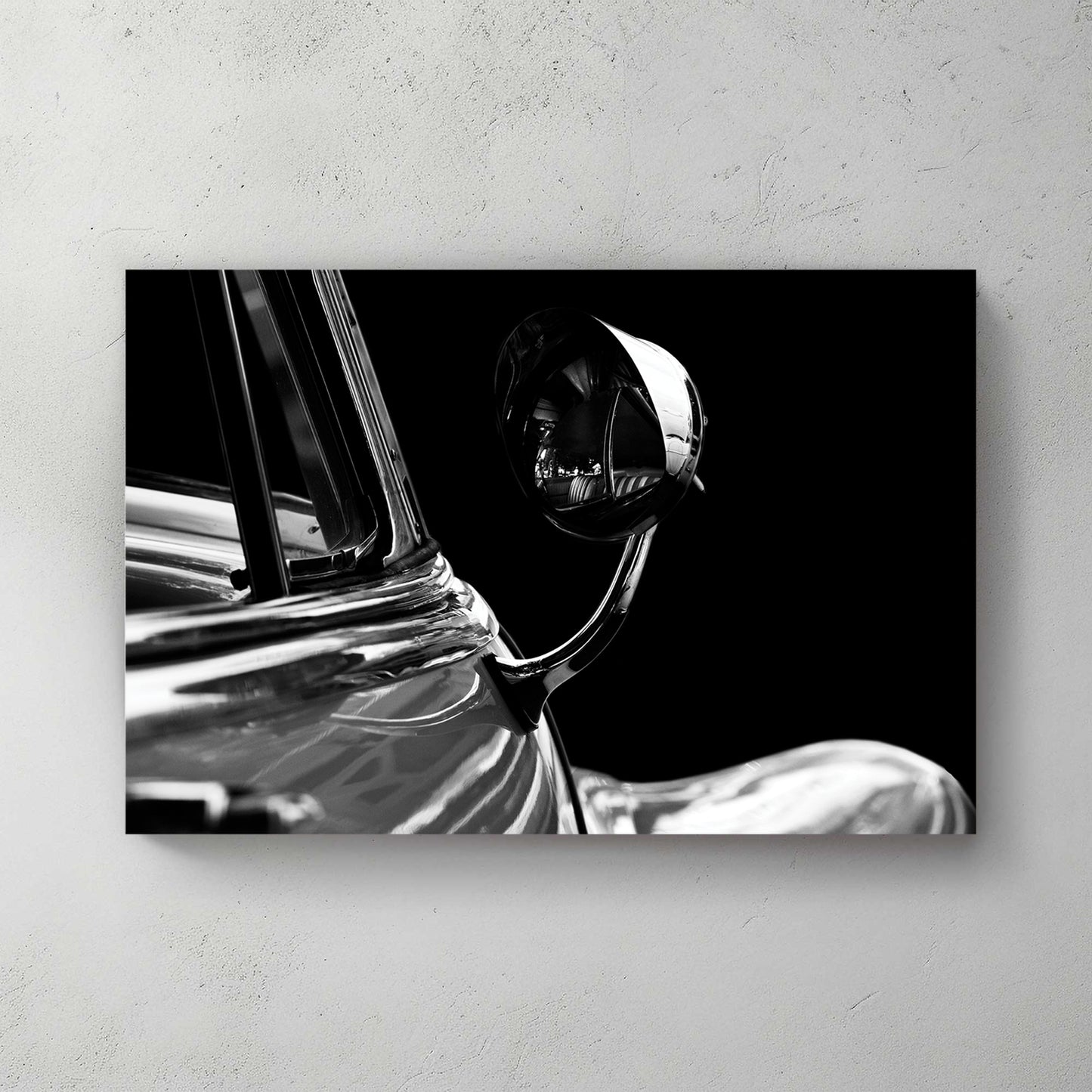 Dramatic black-and-white close-up of a chrome bullet side mirror on a dark '53 Buick, deep shadow — canvas wall art print