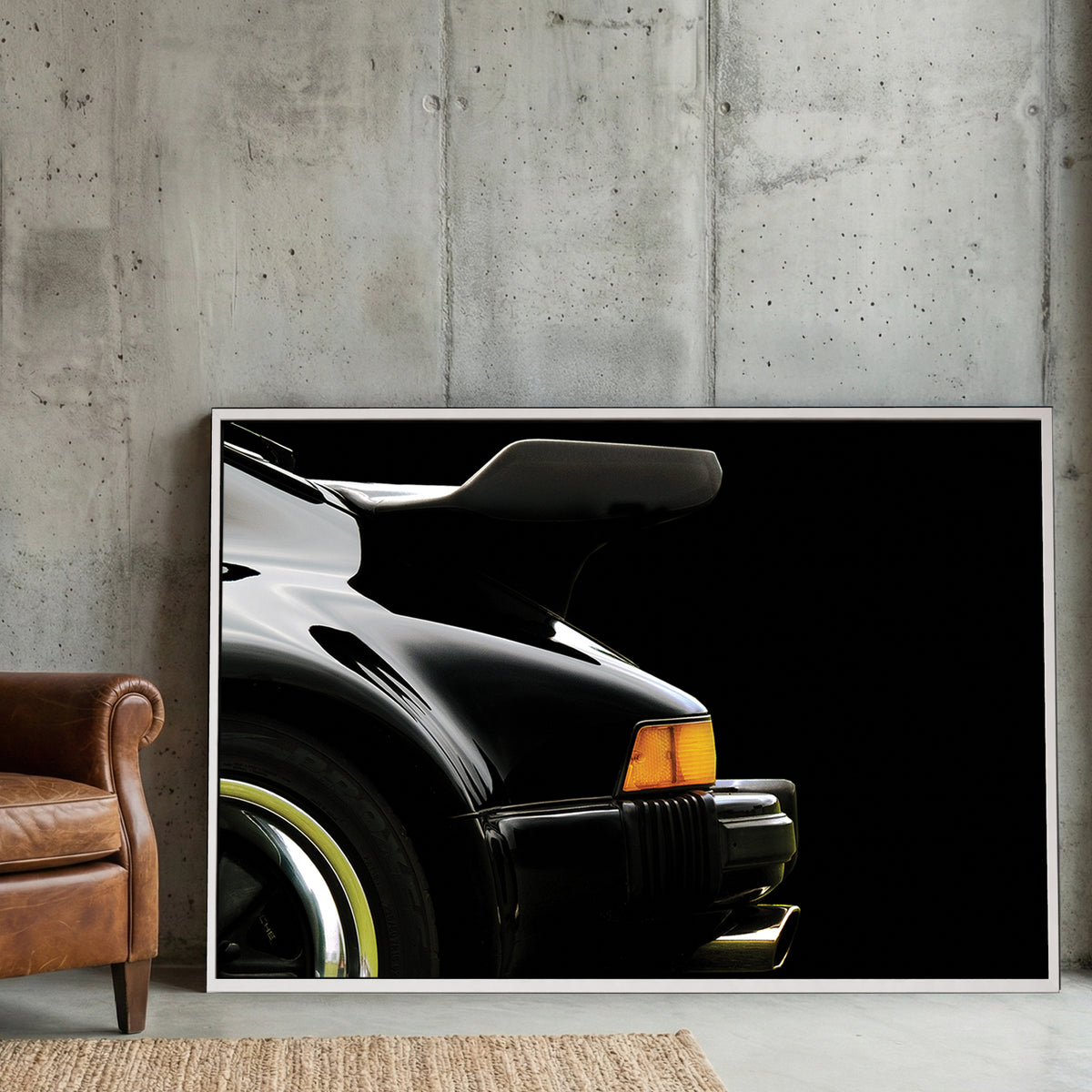 Black Porsche 911 Turbo Wing canvas wall art print displayed in a styled living room