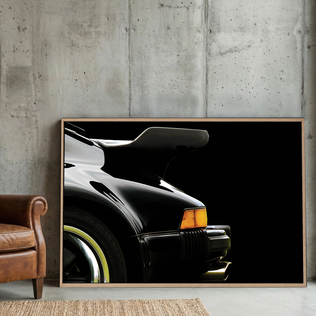 Black Porsche 911 Turbo Wing canvas wall art print displayed in a styled living room