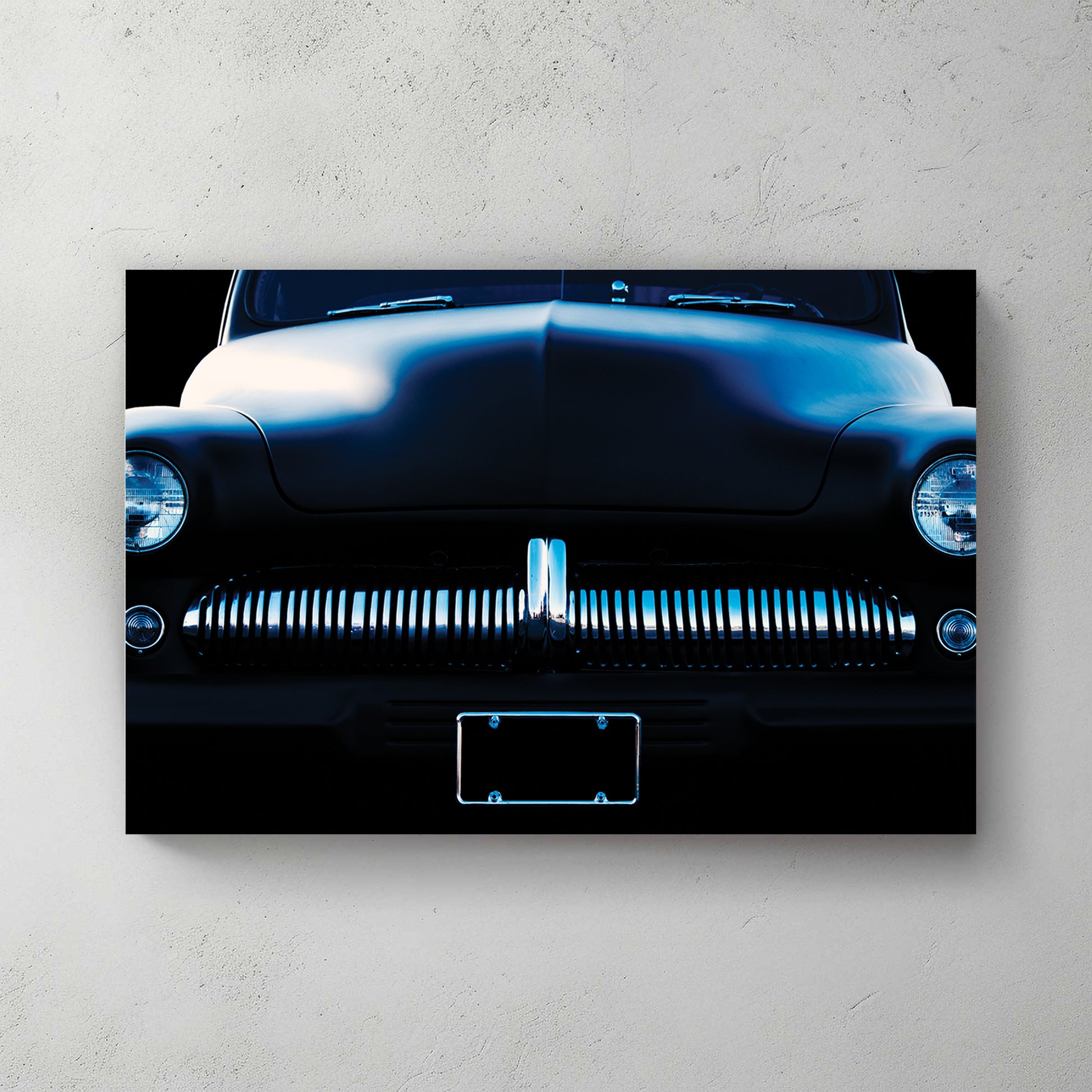 Blue-toned front end of a chopped vintage car, chrome ribbed grille and round headlights against black — canvas wall art print