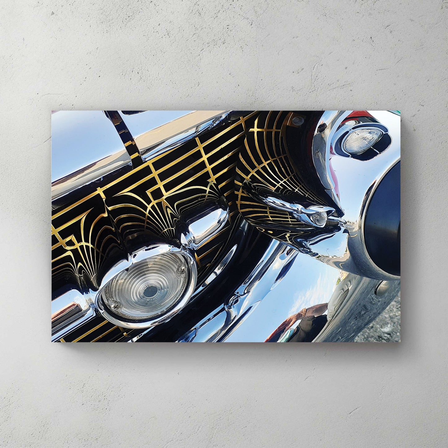 Extreme close-up of a chrome bumper and grille with gold Art Deco pinstriping and mirror reflections — canvas wall art print