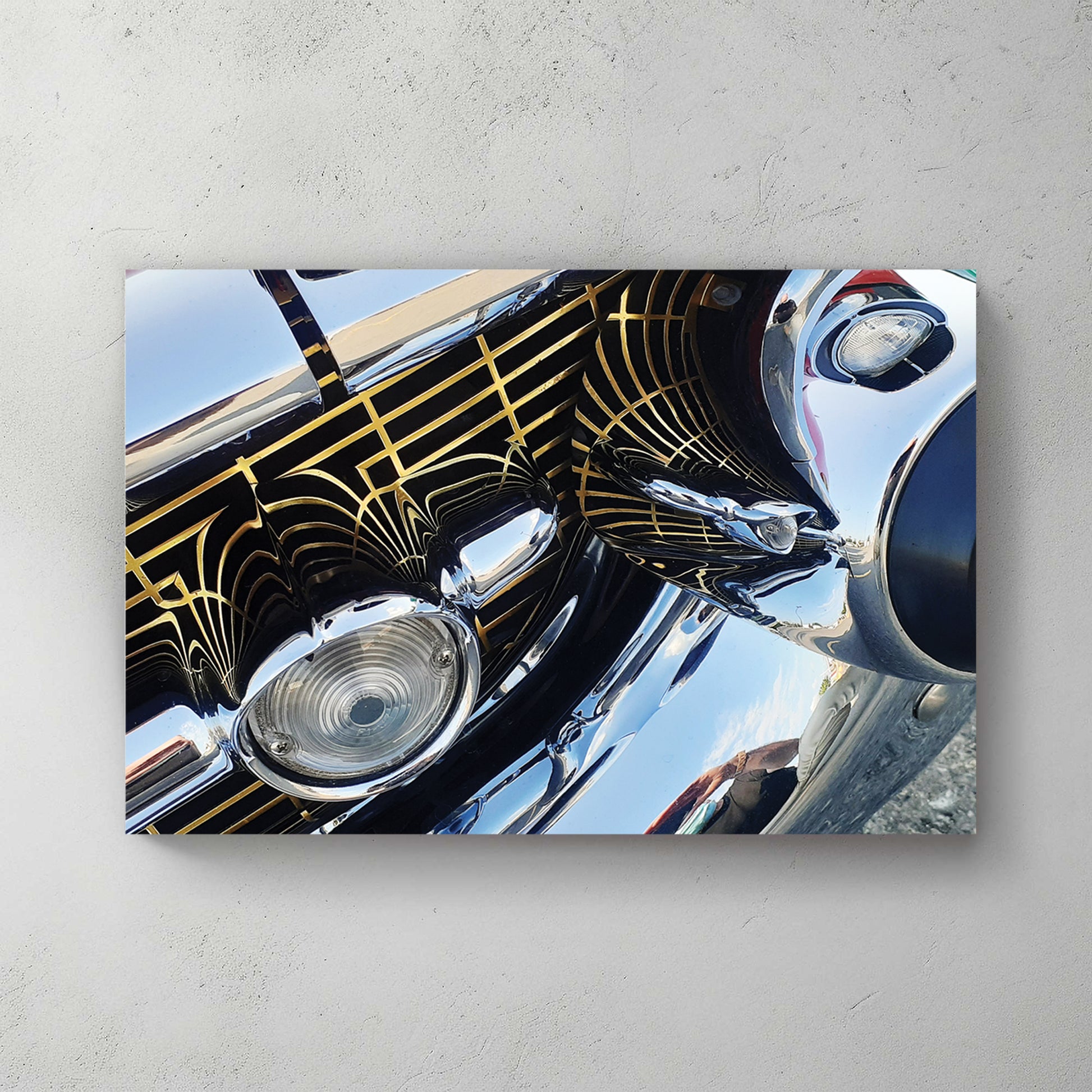 Extreme close-up of a chrome bumper and grille with gold Art Deco pinstriping and mirror reflections — canvas wall art print