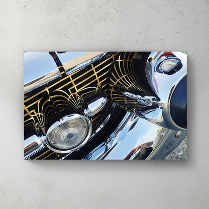 Extreme close-up of a chrome bumper and grille with gold Art Deco pinstriping and mirror reflections — canvas wall art print