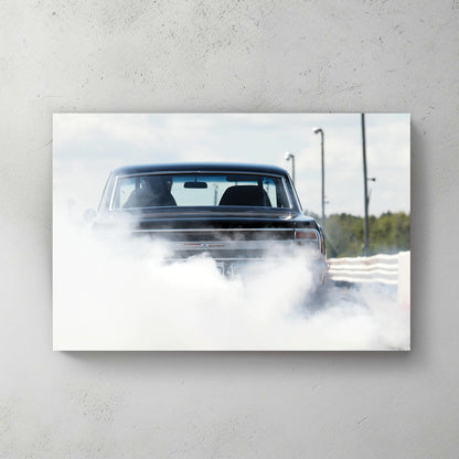 Black muscle car doing a burnout, rear wrapped in a cloud of white tire smoke on a sunny strip — canvas wall art print