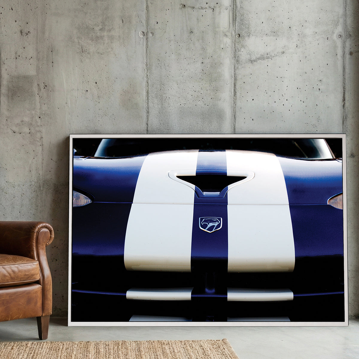 Blue Dodge Viper canvas wall art print displayed in a styled living room