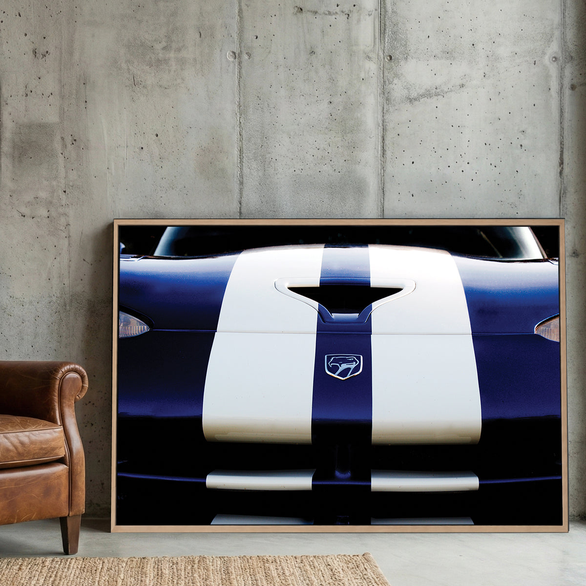 Blue Dodge Viper canvas wall art print displayed in a styled living room