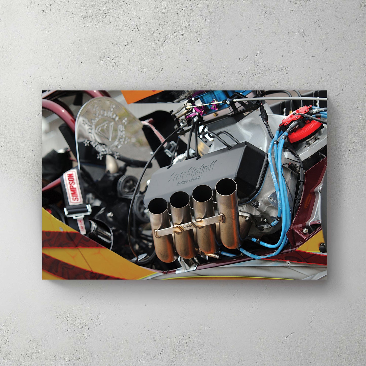 Close-up of a chromed top-fuel engine, four zoomie headers, blue plug wires, orange bodywork — canvas wall art print