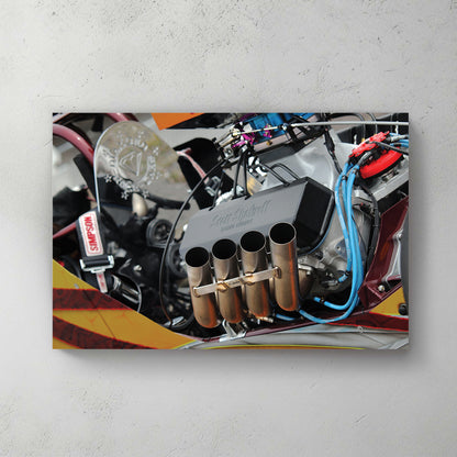 Close-up of a chromed top-fuel engine, four zoomie headers, blue plug wires, orange bodywork — canvas wall art print