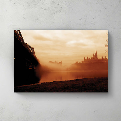 Sepia silhouette of Ottawa's Parliament and Chateau Laurier through river fog, dark bridge in the foreground — canvas wall art print