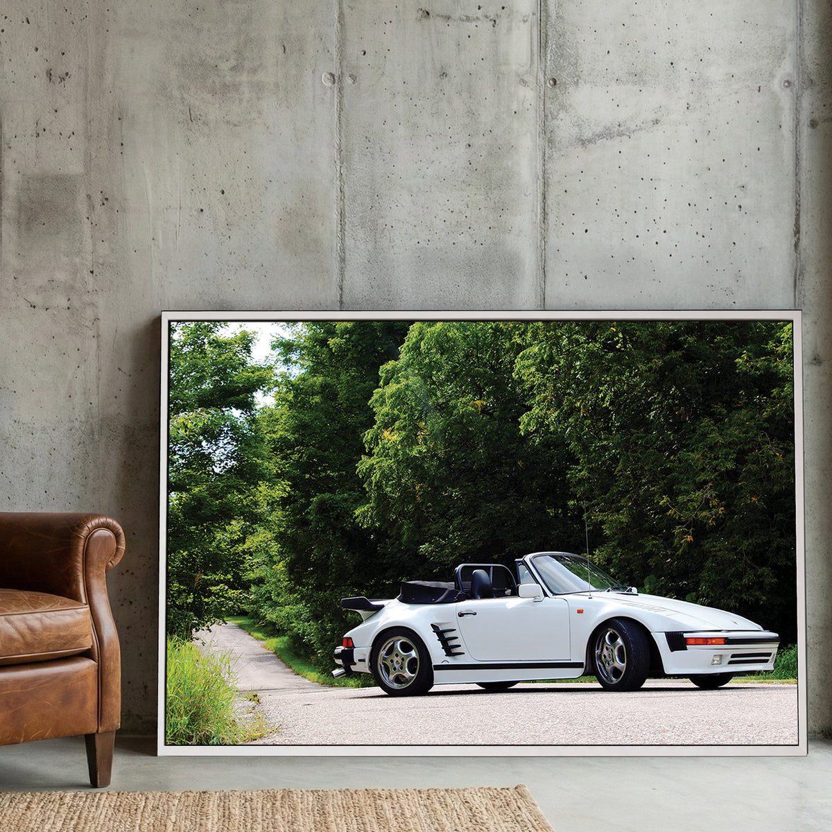 White Porsche 911 Cabriolet canvas wall art print displayed in a styled living room
