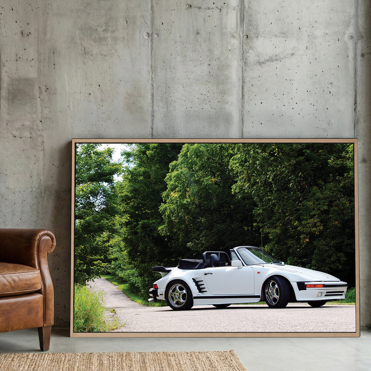 White Porsche 911 Cabriolet canvas wall art print displayed in a styled living room