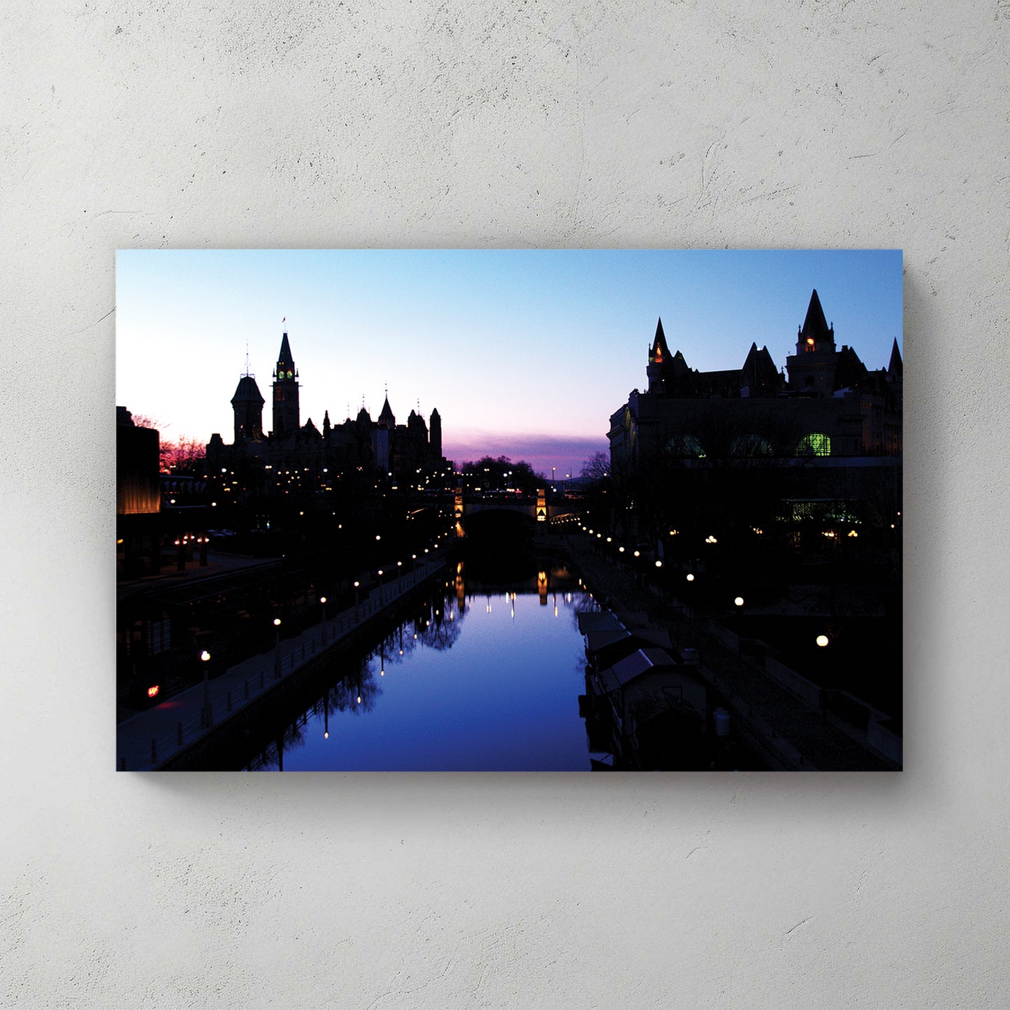 Ottawa skyline silhouette at dusk, Parliament and Chateau Laurier over the still lamplit canal — canvas wall art print