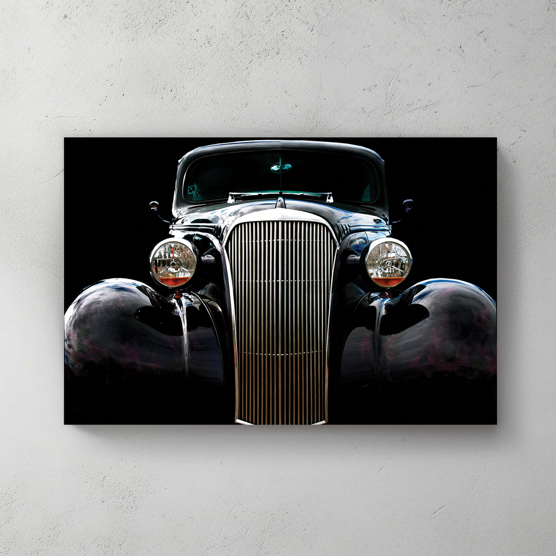 Glossy black '37 Chevy hot rod front on pure black, tall chrome grille and round headlights — canvas wall art print