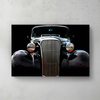 Glossy black '37 Chevy hot rod front on pure black, tall chrome grille and round headlights — canvas wall art print